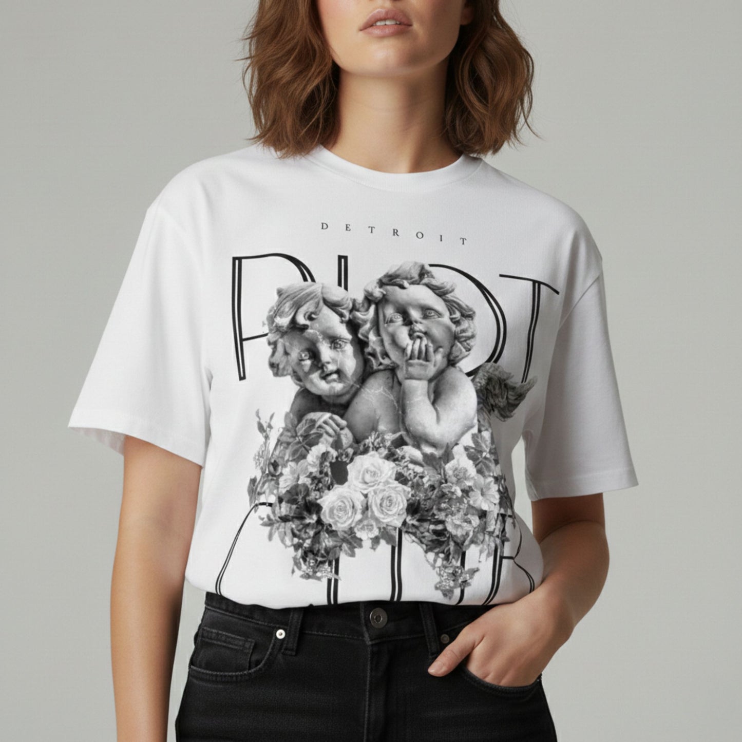 "Portrait view of female model in the Cherubic Bloom Tee. Emphasizing the high-fidelity archival print and the ultra-smooth 100% cotton face of the 6.5oz hardware."