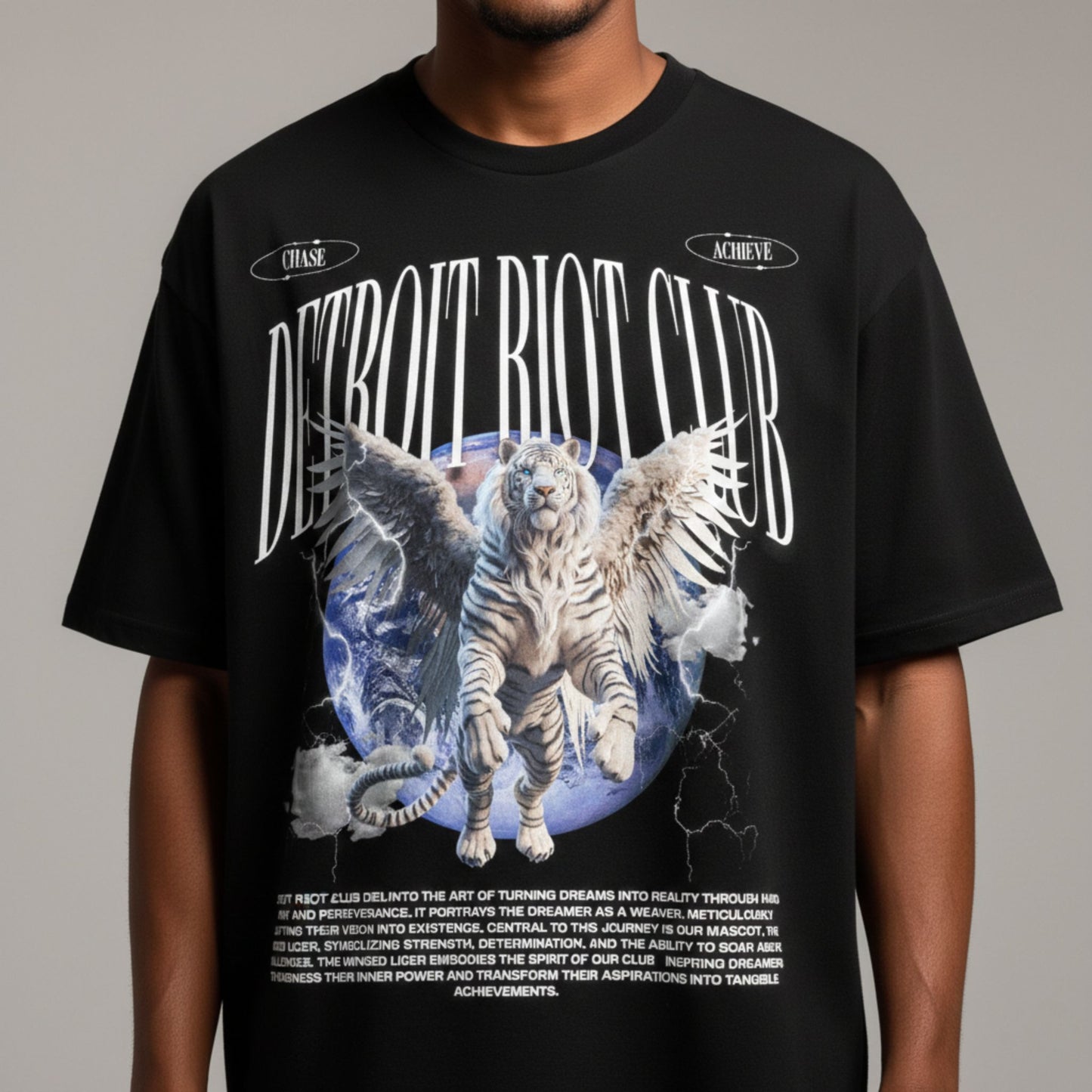 "Close-up portrait of male model in the Liger Odyssey Tee. Emphasizing the crisp, high-contrast mascot iconography and ultra-smooth 100% cotton face hardware."