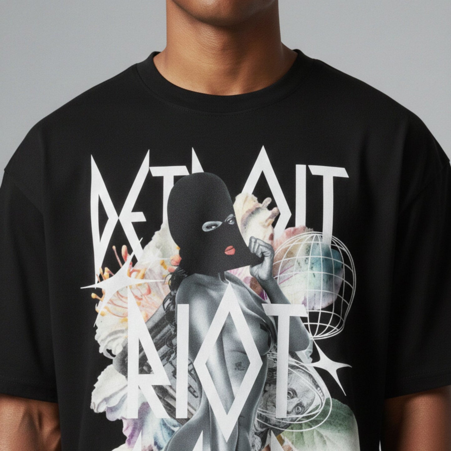 High-fidelity surrealist graphic on a black heavyweight tee featuring a masked female silhouette layered with floral blooms, geometric globes, and sharp Detroit Riot Club typography.
