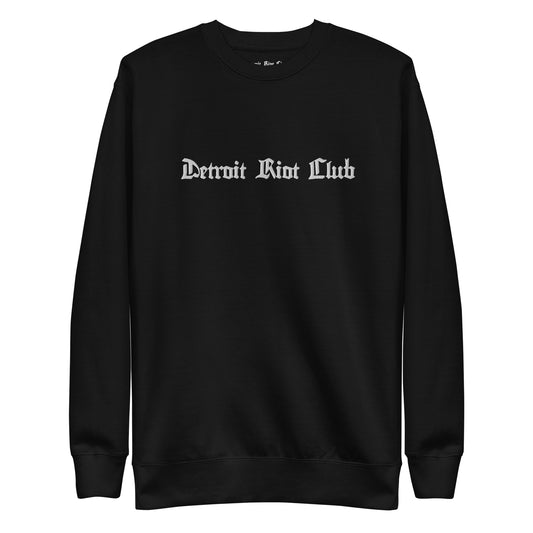 "Flat lay front view of the 8.5oz Archival Crewneck artifact. Showcases the premium 100% cotton face texture and crisp brand embroidery in Void Black."