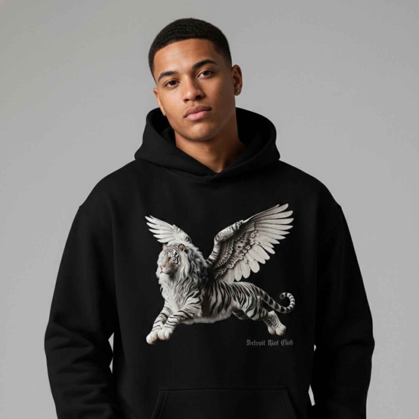 Detroit Riot Club Aether Liger Hoodie in Void Black, 9.4oz heavyweight hardware, male model front view, hood off premium streetwear.