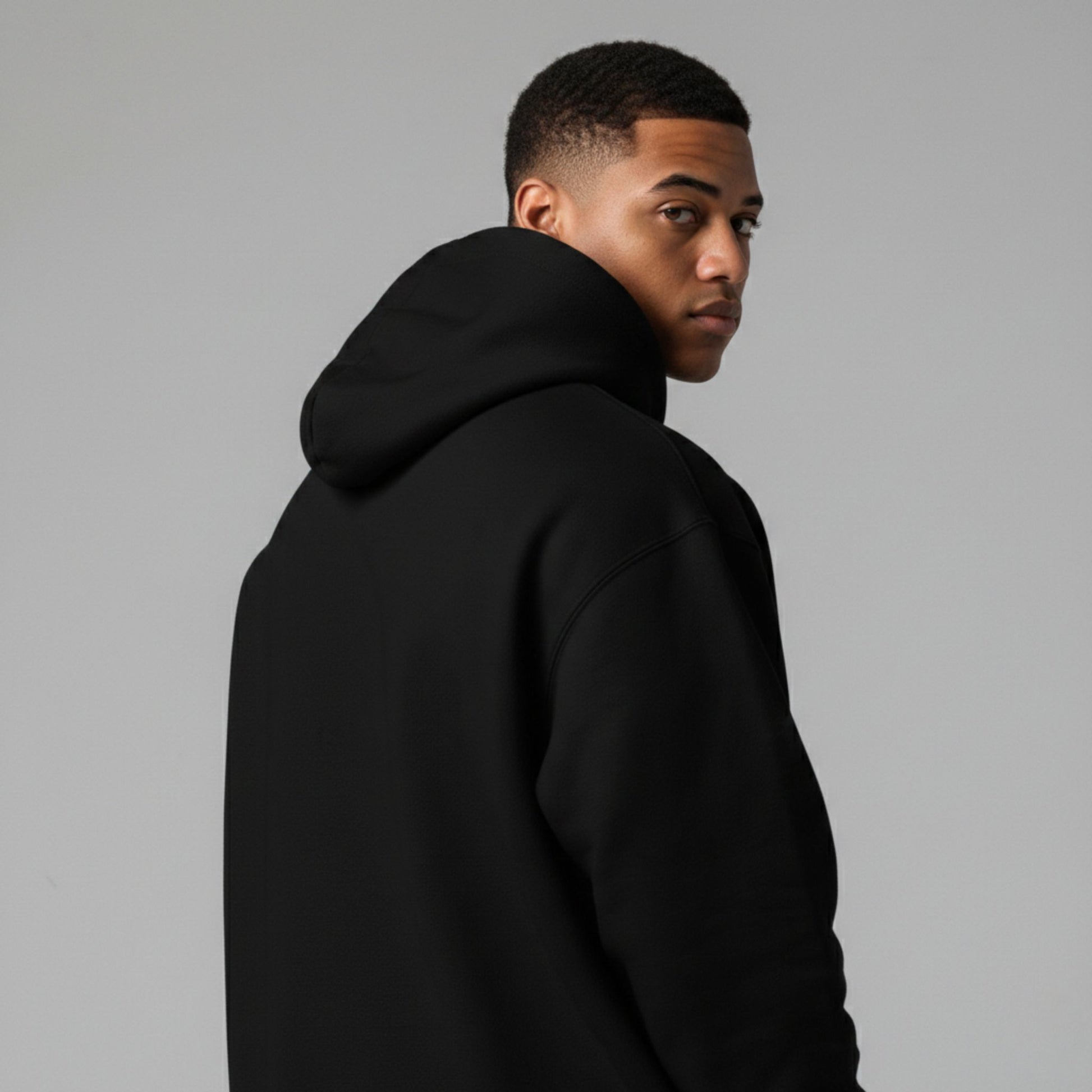 Detroit Riot Club Aether Liger Hoodie in Void Black, 9.4oz heavyweight hardware, male model rear view, premium streetwear