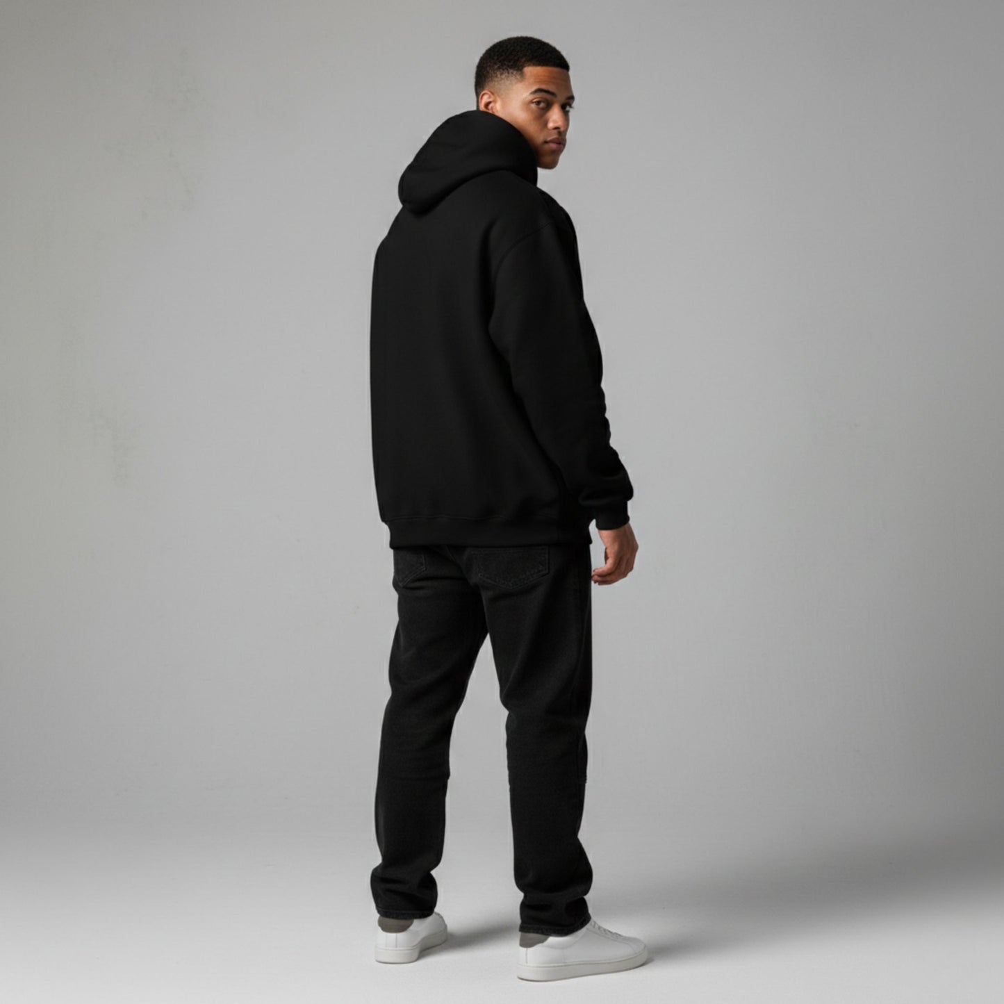 Detroit Riot Club Aether Liger Hoodie in Void Black, 9.4oz heavyweight hardware, male model rear view, full silhouette, premium streetwear.